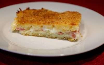 Patate grattugiate al forno con ripieno di prosciutto e mozzarella